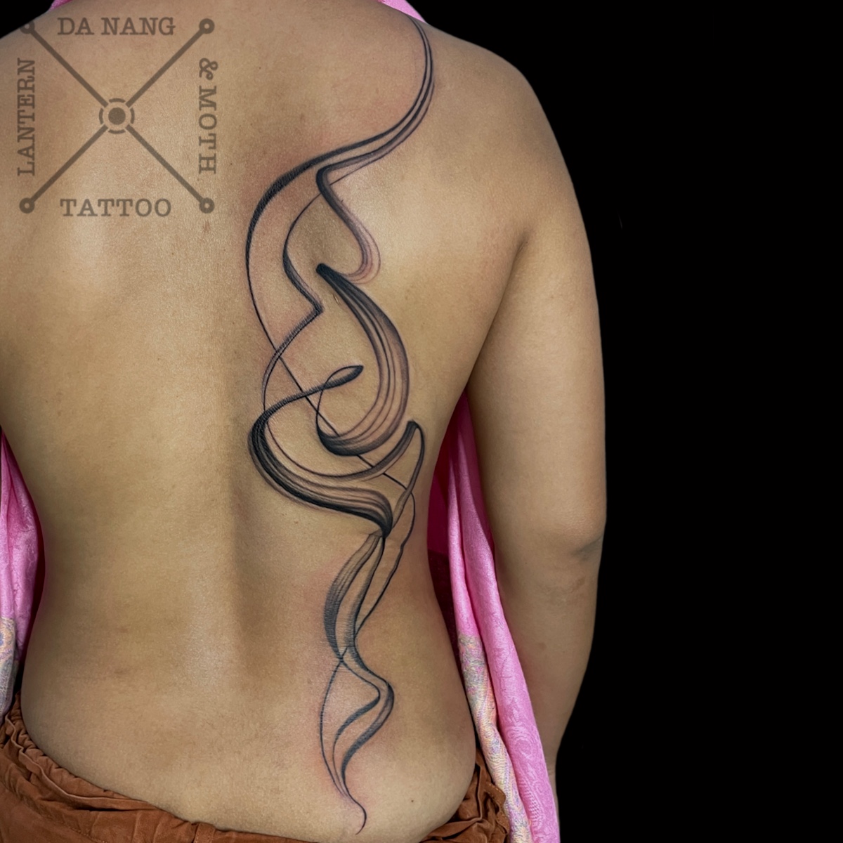 Flowing-Abstract-half-back-Tattoo-by-Da-Nang-Tattoo-Artist