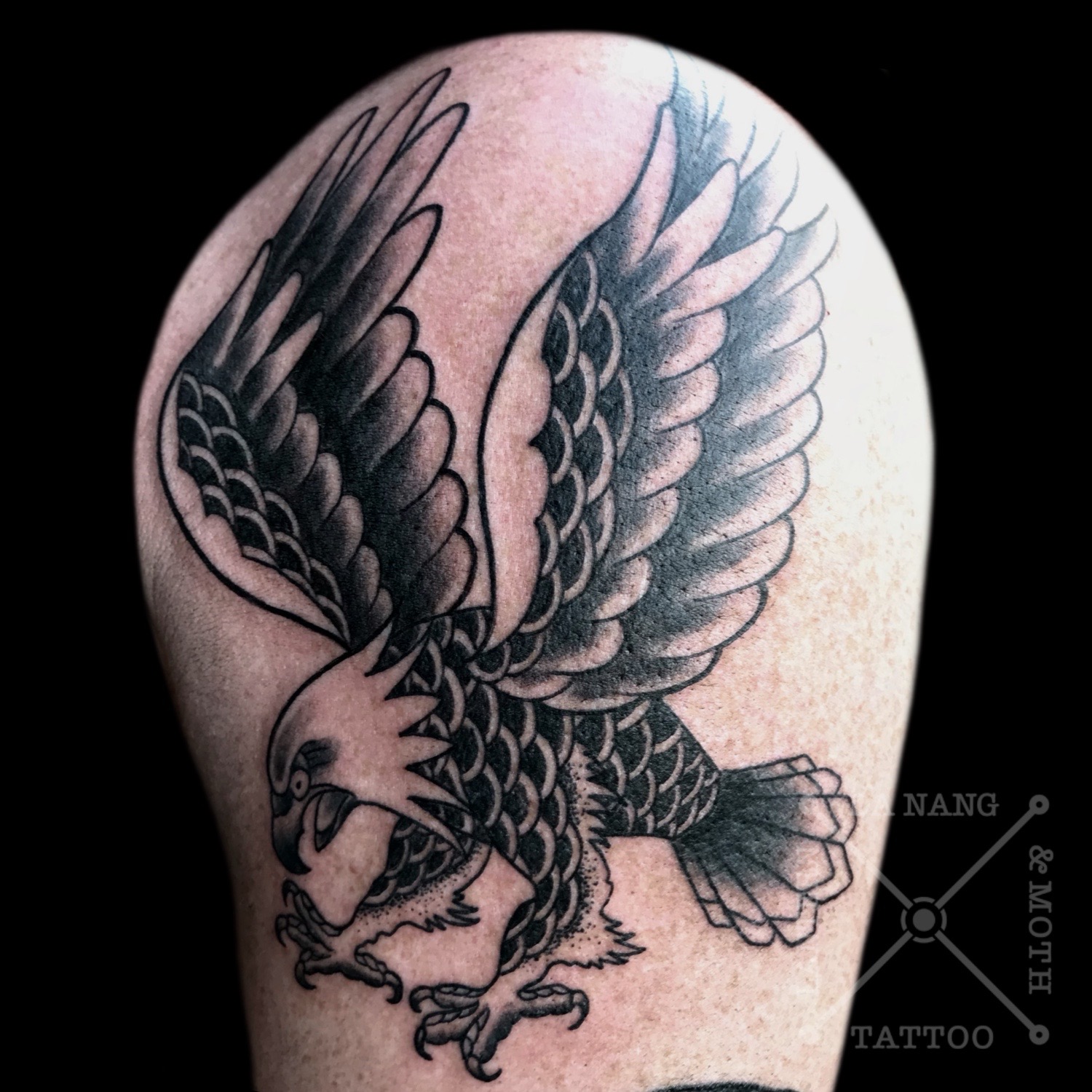 Black trad eagle tattoo
