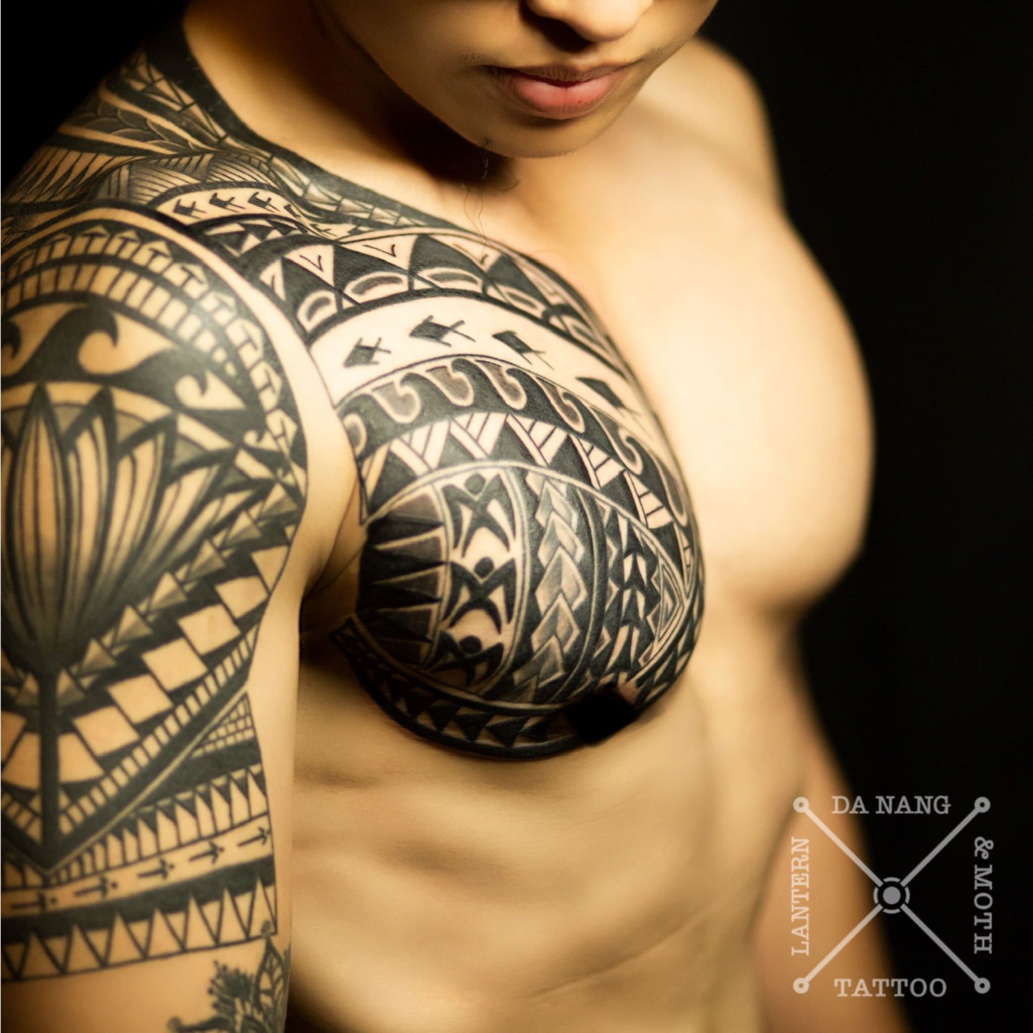 Polynesian-shoulder-and-chest -design-danang-tattoo-shop-lantern-and-moth.